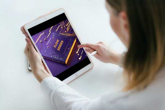 Person using a tablet with a 'Flow Series' course cover displayed on the screen