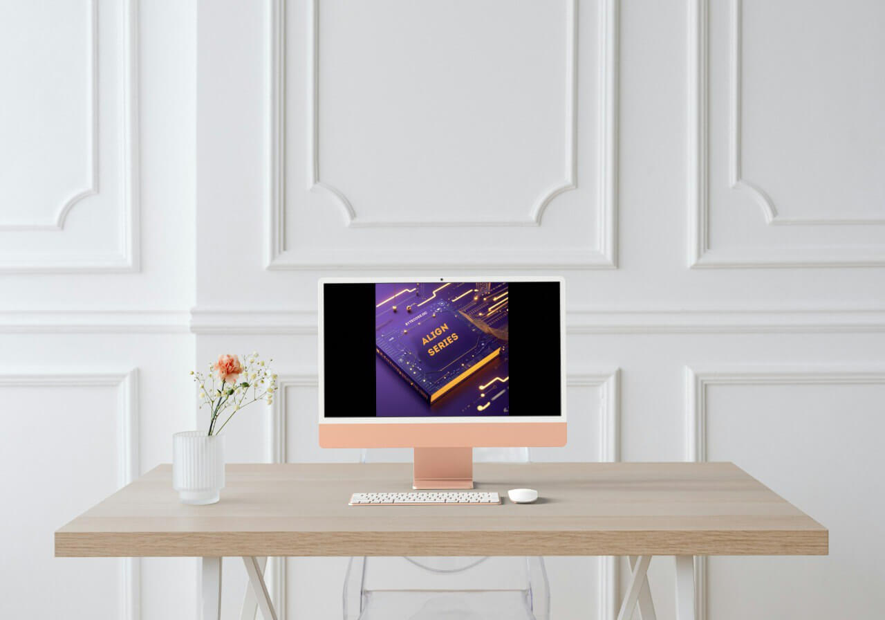 Modern desk setup with a computer monitor displayed 'Align Series' course, keyboard, and mouse on a light wood desk against a white paneled wall.