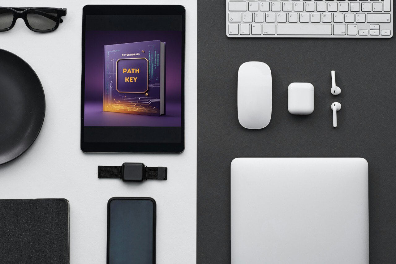 Flat lay of electronic devices with 'Path Key' course and accessories on a black and white surface